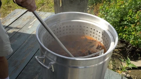 Man Stirs Crawfish in Boiling Pot Video stock 97123067