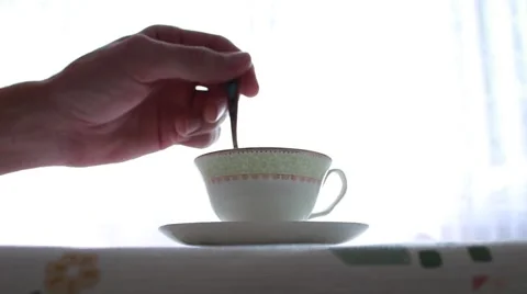 Man stirs sugar in a cup 動画素材 52686616