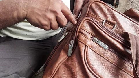 A Man Stitching, Fix or Repair Brown Leather Bag O Ring By Hand In India - Stock Footage 226345811