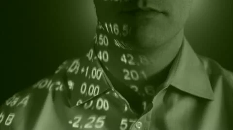 A man with the stock-exchange quotation reflected on his face Stock Footage 11292370