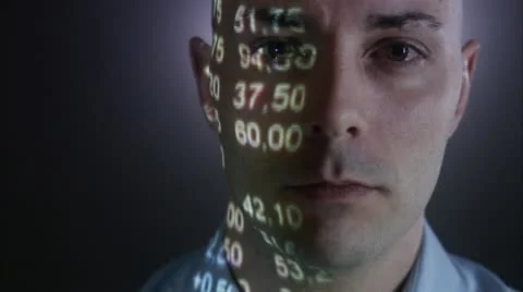A man with the stock-exchange quotation reflected on his face Stock Footage 11292373