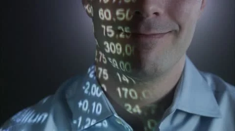 A man with the stock-exchange quotation reflected on his face Stock Footage 11292375