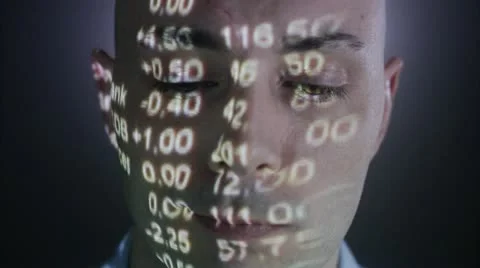A man with the stock-exchange quotation reflected on his face Stock Footage 11292381