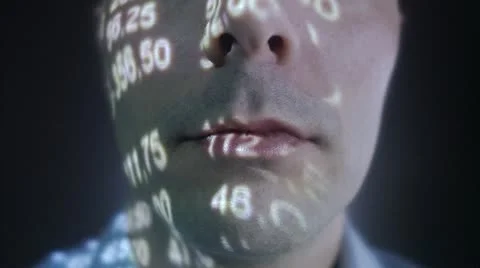 A man with the stock-exchange quotation reflected on his face Stock Footage 11292405