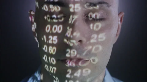 A man with the stock-exchange quotation reflected on his face. Stock Footage 51859399