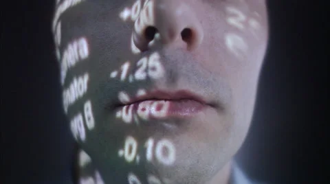 A man with the stock-exchange quotation reflected on his face. Stock Footage 51859448