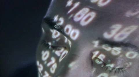 A man with the stock-exchange quotation reflected on his face. Stock Footage 51859454