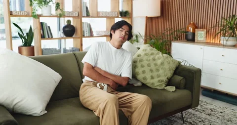 Man, stomach ache and sofa with pain for constipation, diarrhea or Stock Footage 327785111