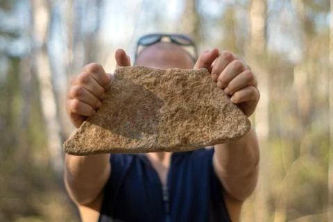 Man with a stone Stock Photos