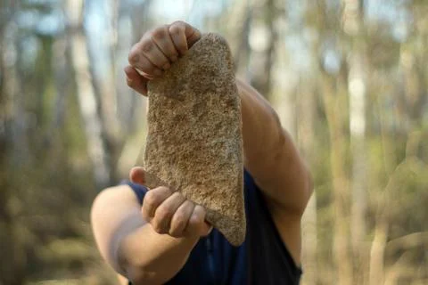 Man with a stone Stock Photos