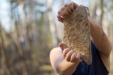 Man with a stone Stock Photos