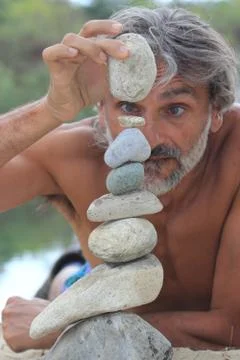 MAN STONE PILE Stock Photos
