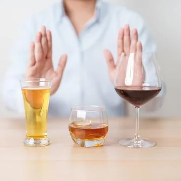 Man stop hand gesture to refuse a glass of wine, beer, whiskey or cognac on.. Stock Photos