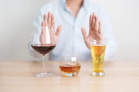 Man stop hand gesture to refuse a glass of wine, beer, whiskey or cognac on.. Stock Photos