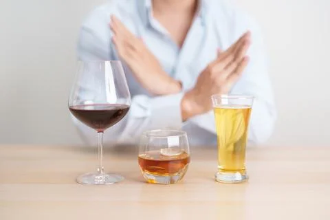 Man stop hand gesture to refuse a glass of wine, beer, whiskey or cognac on.. Stock-Fotos