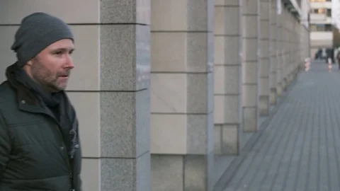 Man Stopping and Taking a Cigarette into his Mouth Stock Footage 82345474