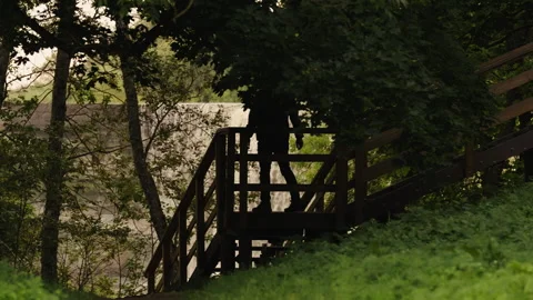 Man Stops on Wooden Viewing Platform Stock Footage 343269881
