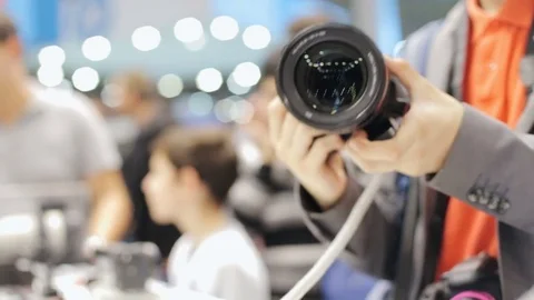 A man in a store buys a photo camera Stock Footage 80909322