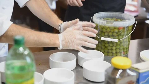 Man straightens the cups on the table Stock Footage 81543576