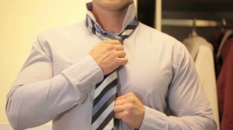 Man straightens his tie Stock Footage 48984058