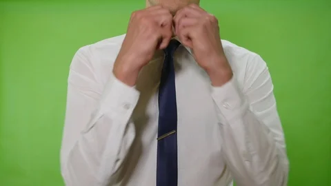 Man straightens his tie Stock Footage 113471379