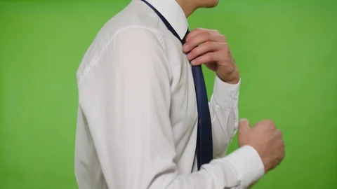 Man straightens his tie Stock Footage 113471400