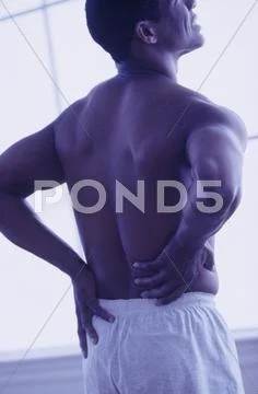 Man with a strained back Stock Photos