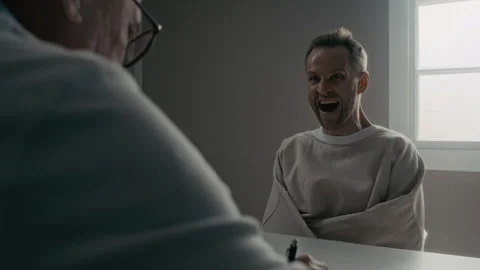 Man in Straitjacket Having Psychiatric Interview with Doctor Stock Footage 336666670