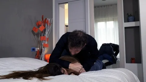 Man strangling and hitting girlfriend at home domestic violence after coronav Stock Footage 127519093
