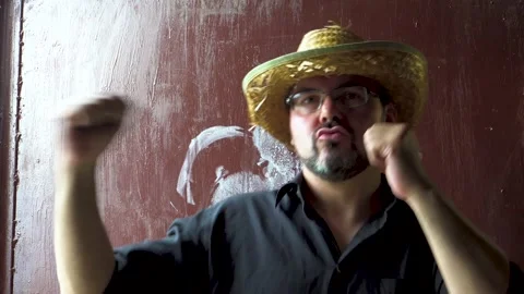 Man in a straw hat dancing 4K Stock Footage 196727552