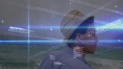 Man in straw hat standing at shore as binary overlay appearing and spreading for Stock Footage 311048893