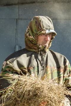 Man with straw Stock Photos