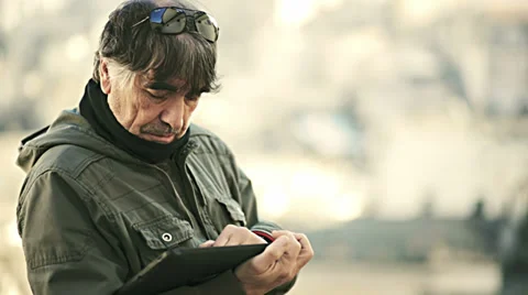 Man on the street and looking map on tablet computer Stock Footage 34278178
