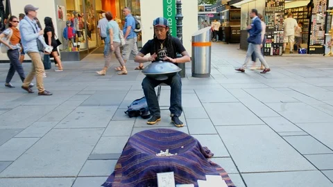 Man on the street Playing Bongo Drum Close Up. Street musician Vienna Austria 09 Stock Footage 102863677