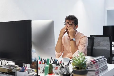 Man, stress and computer with headache in office for project deadline or bu.. Stock Photos