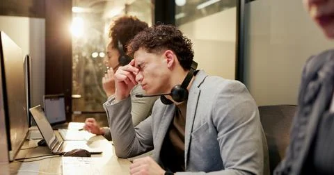 Man, stress and headache with computer at call centre for customer service,.. 스톡 사진