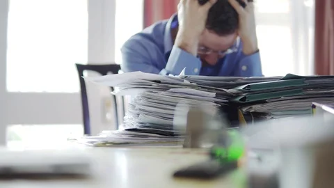 A Man Is Stressed And Sad In Front Of Pile Of Letters, Debt Or Overworked Stock-Footage 85822948