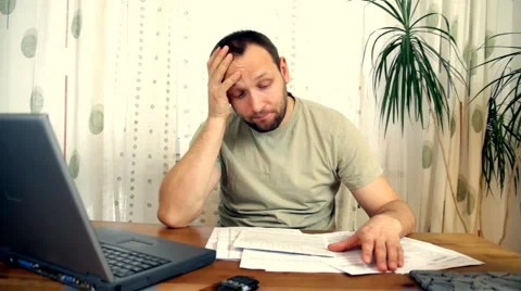 Man stressed because of bills Stock Footage 1007233