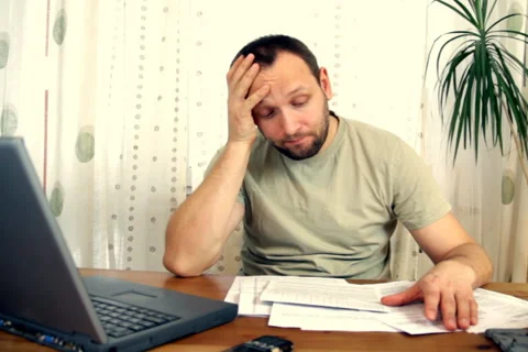 Man stressed because of bills Stock Footage