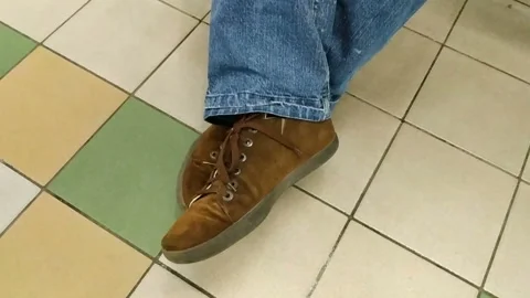 The man stretch out on the bench. Relax indoors, public place, real time, close- Stock Footage 130674258