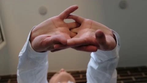 Man stretching his hands during the working day. A man cracks his knuckles Stock-Footage 215017811