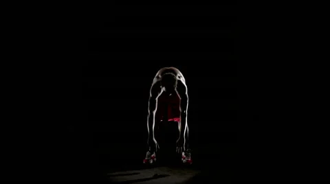 Man stretching isolated on black 動画素材 64497586