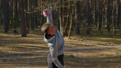 Man Is Stretching In Park Stock Footage 166503838