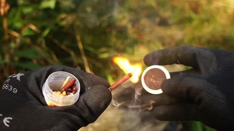 Man Strikes a Match. Man strikes a match for making Campfires. Stock Footage 306517287