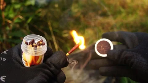 Man Strikes a Match. Man strikes a match for making Campfires. Stock Footage 306517289