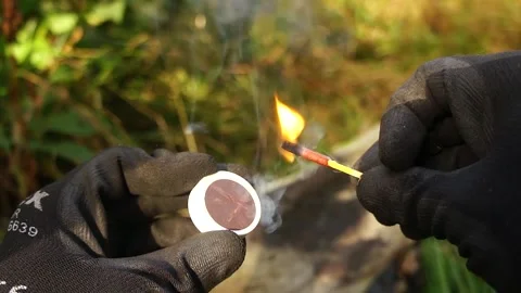 Man Strikes a Match. Man strikes a match for making Campfires. Stock Footage 306517291