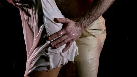 Man is stroking hips and ass of young woman, close-up view of their hips Stock Footage 104214940