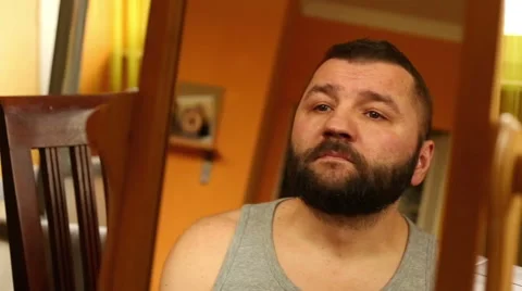 Man stroking his bread  Stock Footage 61303382