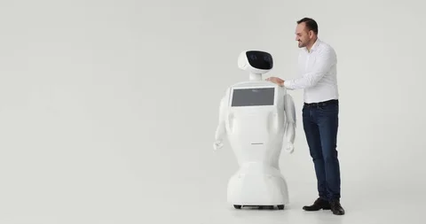 Man stroking a robot. friendship with a robot. Modern Robotic Technologies. A Stock Footage 97967700