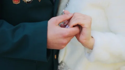 Man stroking a woman's hand close-up Stock Footage 128757806